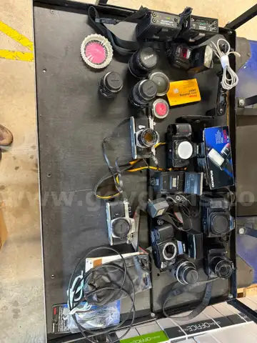 a box and bag full of Camera stuff