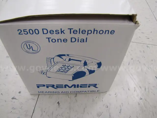 Box of landline desk phones