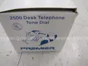 Box of landline desk phones