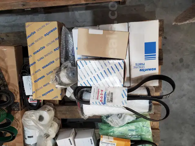A Pallet of Heavy Equipment Filters and Belts