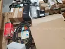 A Pallet of Heavy Equipment Filters and Belts