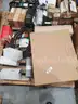 A Pallet of Heavy Equipment Filters and Belts