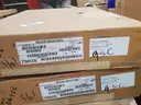 A Pallet of Heavy Equipment Filters and Belts