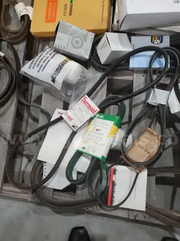 A Pallet of Heavy Equipment Filters and Belts