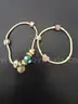 Silver tone bracelets (2) with charms